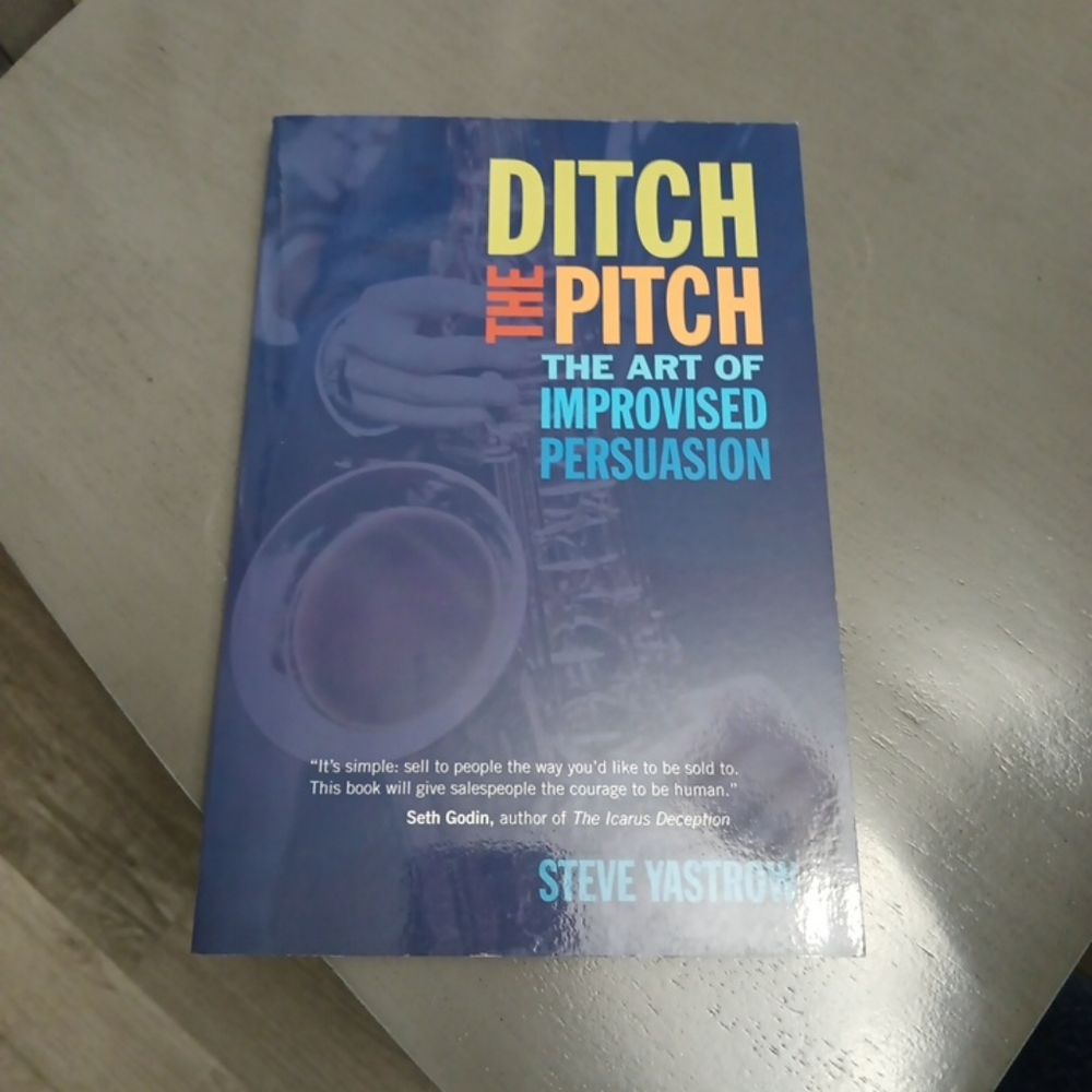 Source Unknown Ditch the Pitch Book - Blue with Yellow & Orange Text